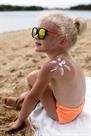 view-young-girl-beach-with-lotion-sunburn-skin.jpg