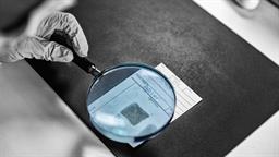 forensic-science-technician-analyzing-evidence-laboratory.jpg